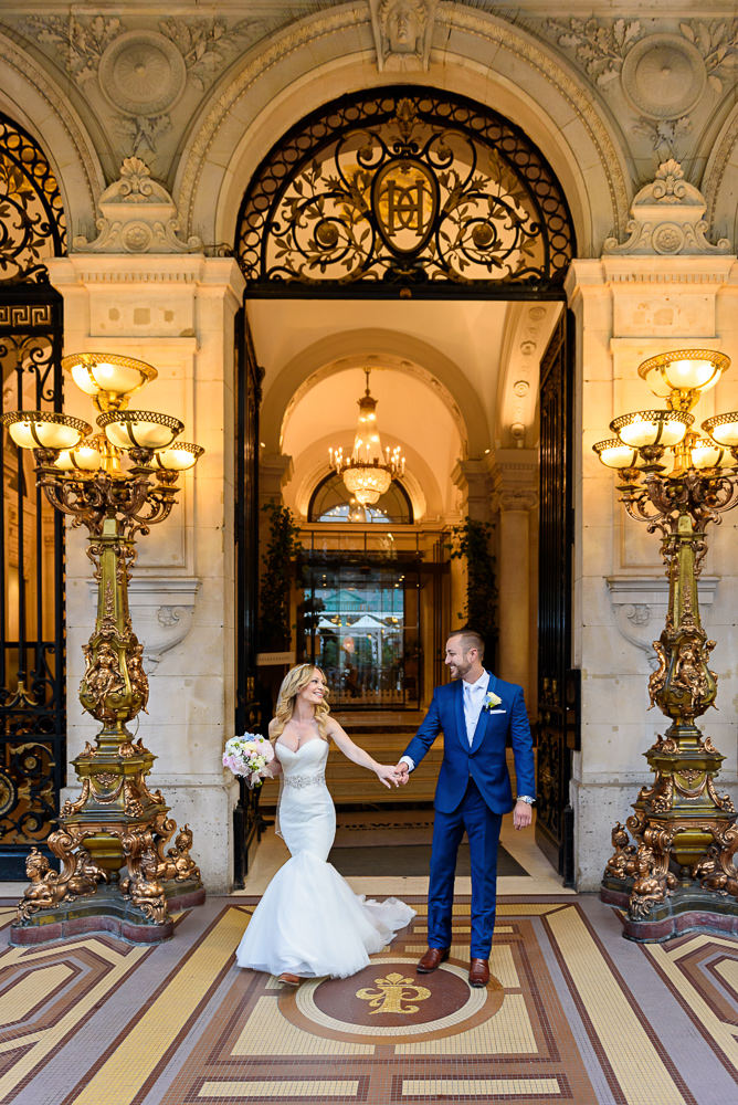 Bride and groom leaving hotel on their way to get eloped in Paris