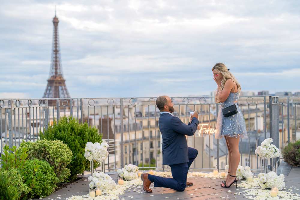 Paris proposal photographer captured moment of gentleman on his knee proposing to his girlfriend on a rooftop overlooking the Eiffel Tower