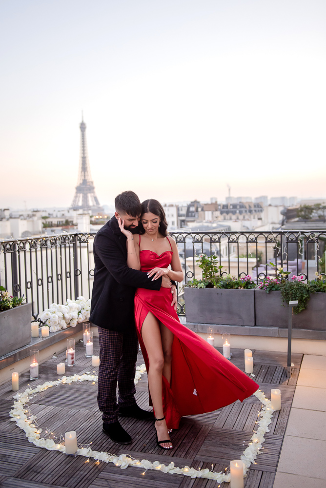 Stylish couple with lady in red dress posing for engagement photos in Paris